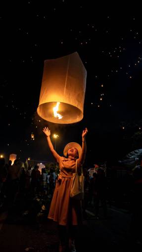 asian-and-indian-ethnicities Lanterns lit in the night sky