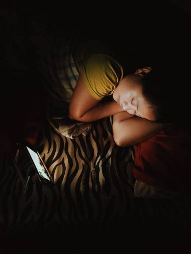 Portrait of a woman sleeping at bed