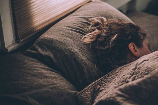 Portrait of a woman sleeping at bed