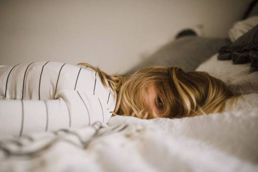 Portrait of a woman sleeping at bed