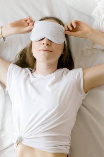 Portrait of a woman sleeping at bed