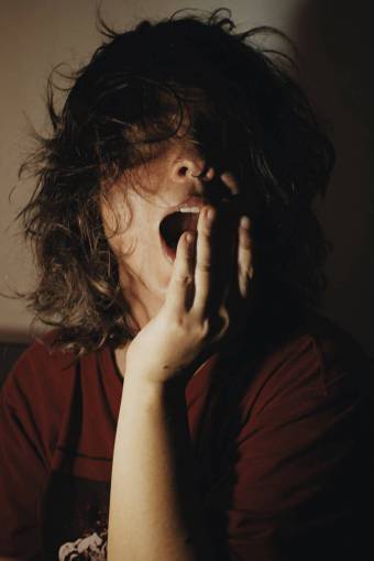 female Portrait of a woman yawning