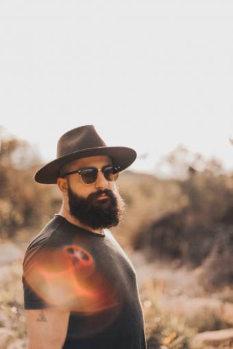 sunlight beard one person hipster;man;hat men lifestyles outdoors adult