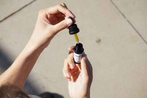 oil cannabis oil adult human hand close-up women