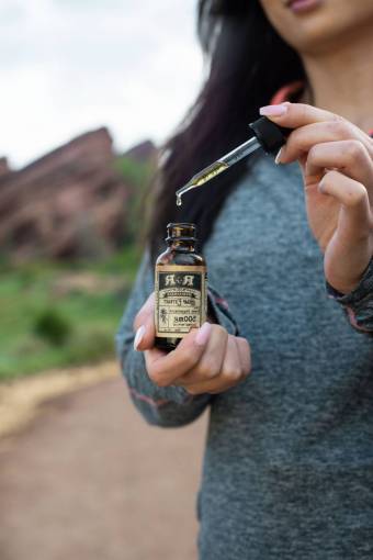 holding one person women cannabis oil human hand adult outdoors