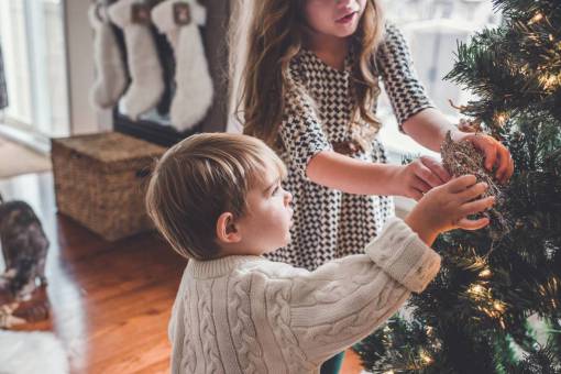 Children decorating christmas tree
