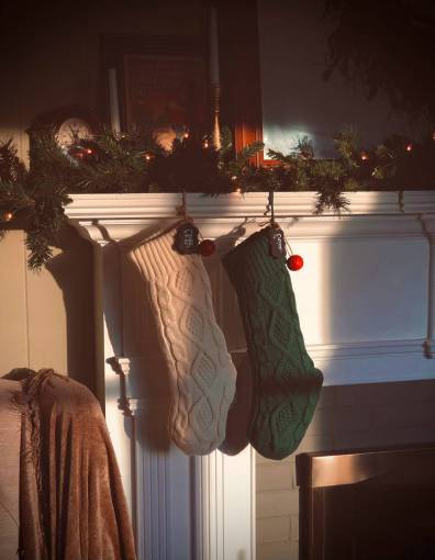 feet Christmas socks in the fireplace