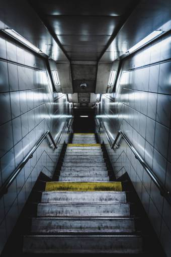 abandoned Illuminated subway entrance staircase