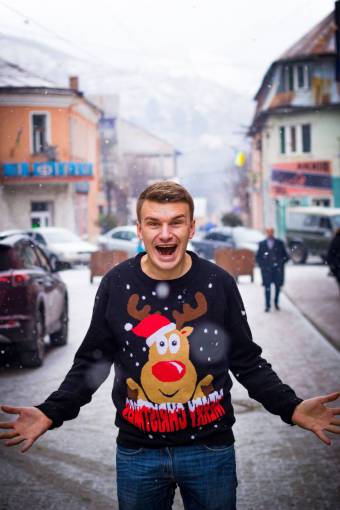 sweater Man with christmas sweater screaming for joy