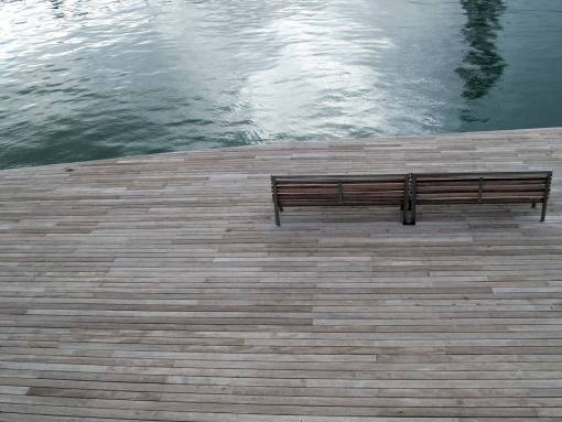 boardwalk barcelona  boardwalk  wood bench  water
