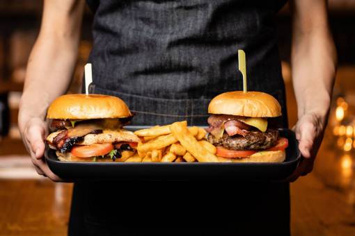 elaborate Chef preparing gourmet burger