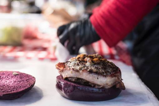 elaborate Chef preparing gourmet burger