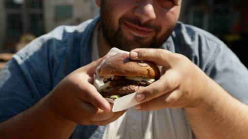 Man eating burger