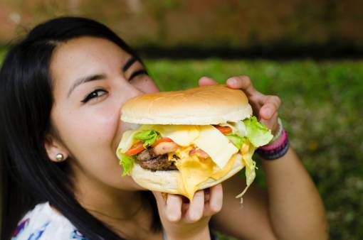 Woman eating burger
