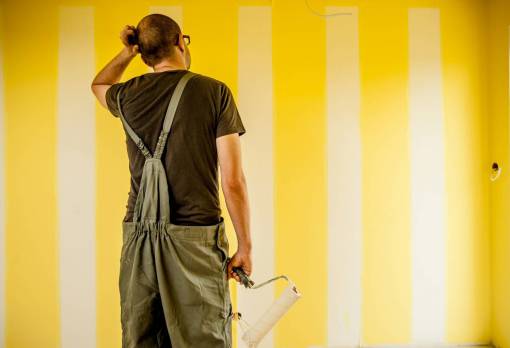 line A man painting a wall