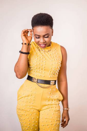 standing-on-one-leg one person women fashion smiling adult studio shot woman;yellow dress