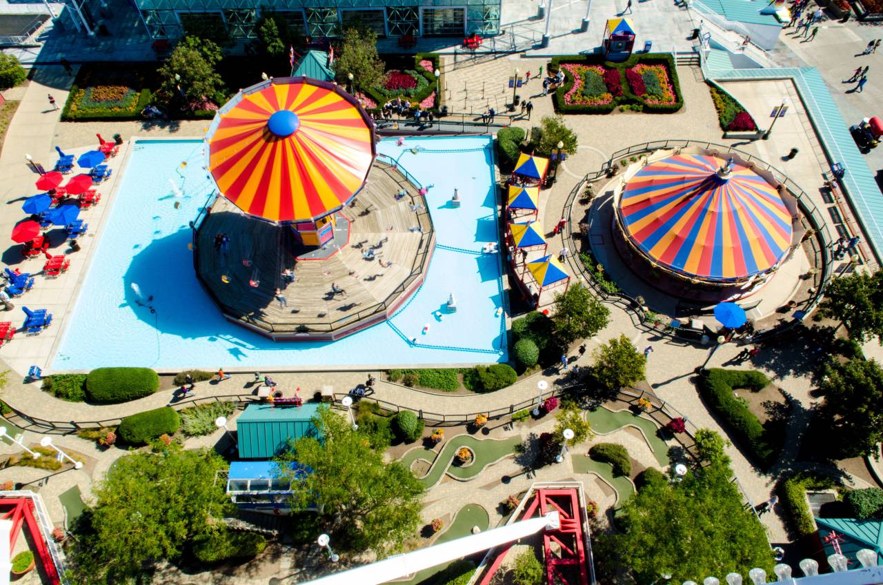 swimming, pool, blue, water, aerial, view, resort, playground, summer, vacation, umbrella, sunny, day, green, grass, trees, plant, nature, view, people, travel
, 