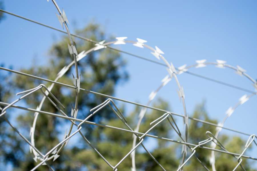 area, barbed, barrier, border, closed, danger, dangerous, fence, forbidden, metallic, prison, private, prohibited, protection, restricted, safety, secure, security, sky, steel, system, watching, wire, 