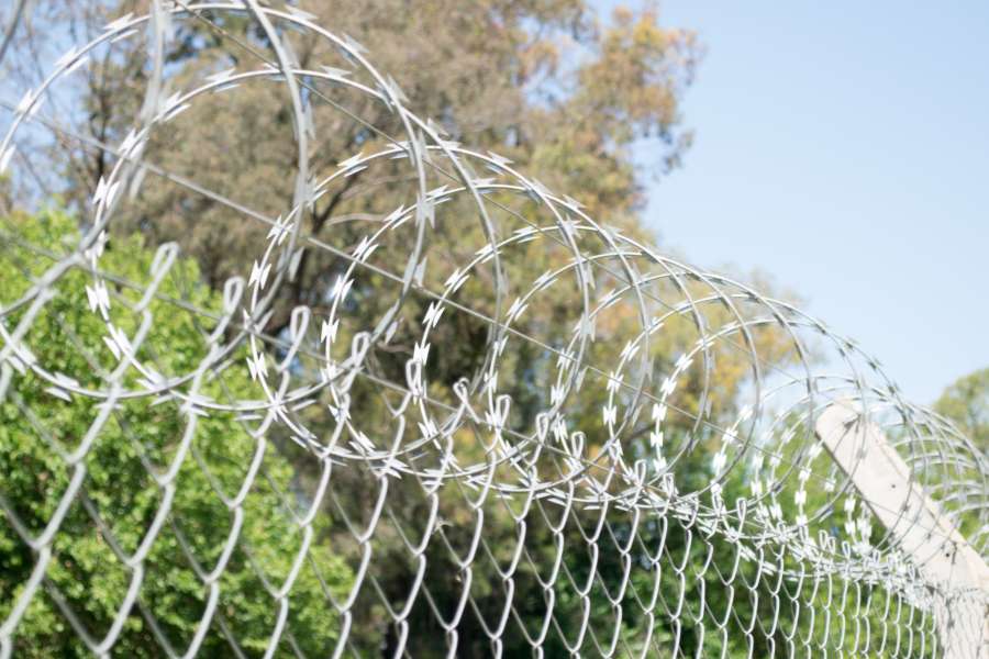 area, barbed, barrier, border, closed, danger, dangerous, fence, forbidden, metallic, prison, private, prohibited, protection, restricted, safety, secure, security, sky, steel, system, watching, wire, 