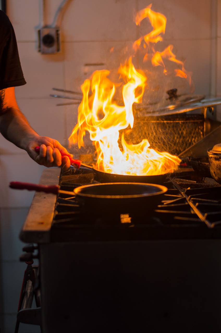 cooking, pan, chef, food, restaurant, fire, kitchen, cook, hot, meal, flame, professional, roast, stove, gourmet, culinary, healthy, cuisine, oven, flambe, dinner, vegetable, gas, hotel, person, service, work, dish, commercial, closeup, oil, burning, modern, male, industry, preparing, fried, cooker, vegetables, hand, tasty, burn, preparation, recipe, lunch, iron, meat, occupation, black, vegetarian, 