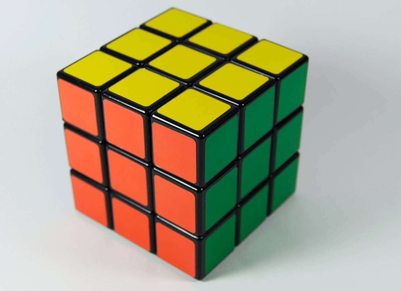 Rubik's Cube, Yellow Side, Green Side, Orange Side, Puzzle, Game, Toy, Brain Teaser, Cubing, Challenge, Logic, Problem Solving, Manipulative, Colorful, Twisty Puzzle, Rubik's Cube Solve, Speedcubing, Mind Game, Intellectual, Dexterity, Spatial Awareness, Rubik's Cube Algorithm, Rubik's Cube Patterns, Cubism, Entertainment, Recreational Activity, Handheld Puzzle, Intellectual Stimulation, Solvable, Twist and Turn, Color Combination, 