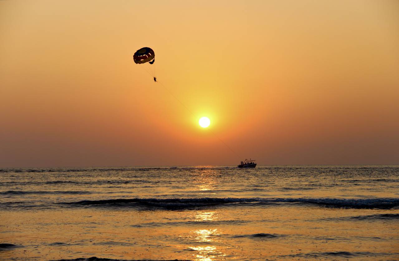 nature, water, ocean, sea, reflection, boat, paragliding, parachute, sunset, sunrise, sky, horizon, clouds, gradient, yellow, gray
, 