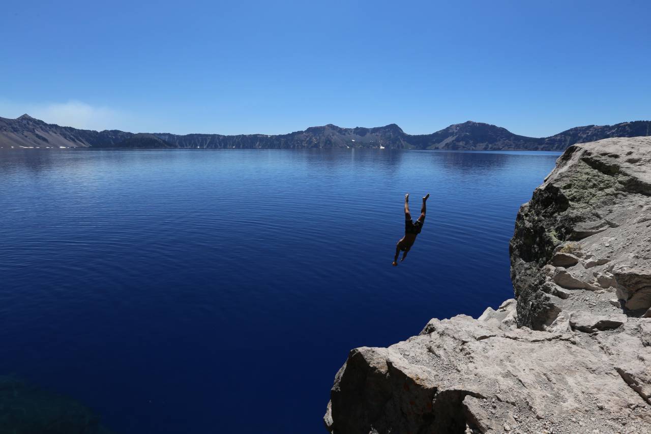 man, diving, lake, water, cold, cliff, blue sky, clear, still, calm, adventure, brave
, 