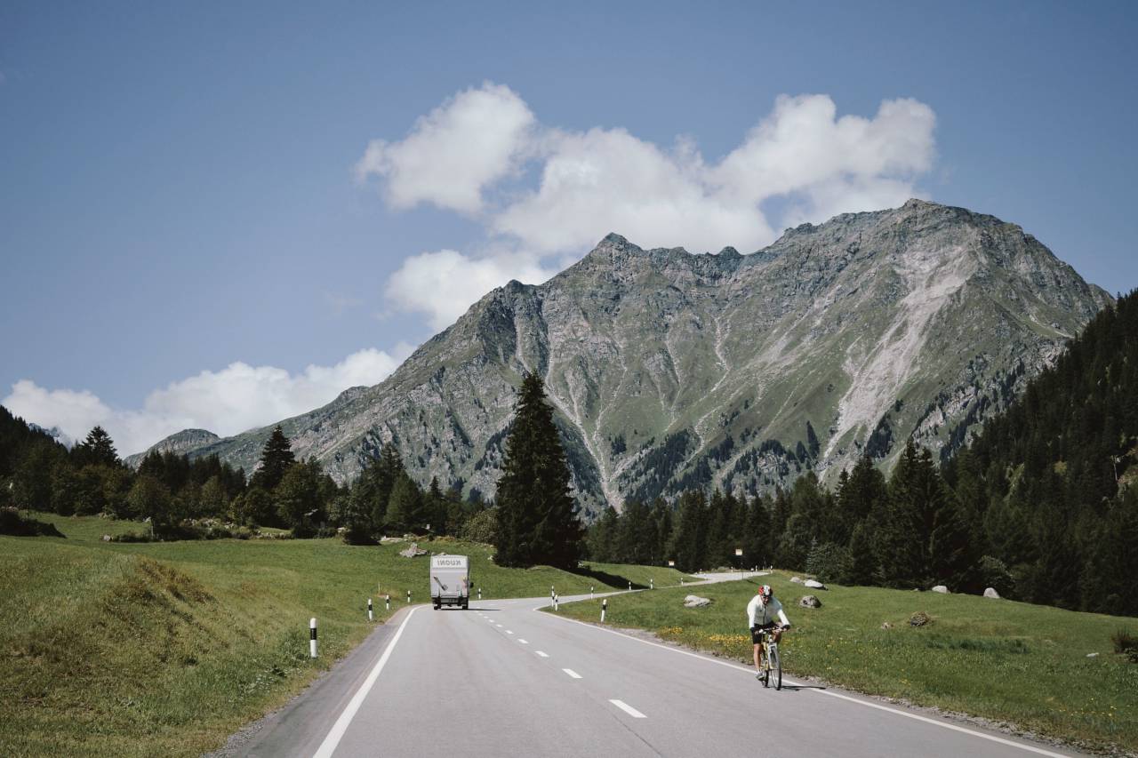 mountain, highland, cloud, sky, summit, ridge, landscape, nature, valley, sunny, day, van, travel, transportation, people, men, ride, bike, road, trip, green, grass
, 