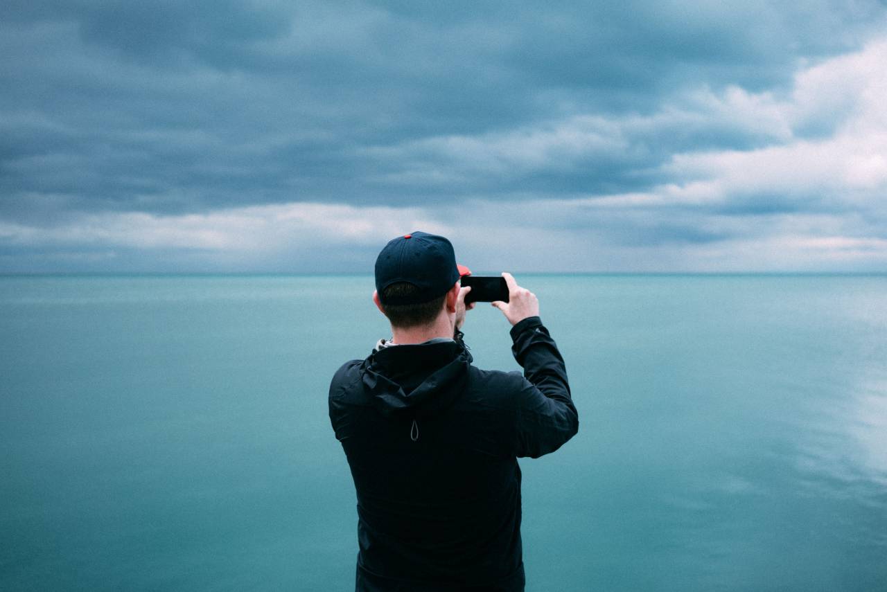 sea, ocean, water, waves, nature, blue, sky, clouds, horizon, people, man, guy, millennials, mobile, phone, camera
, 