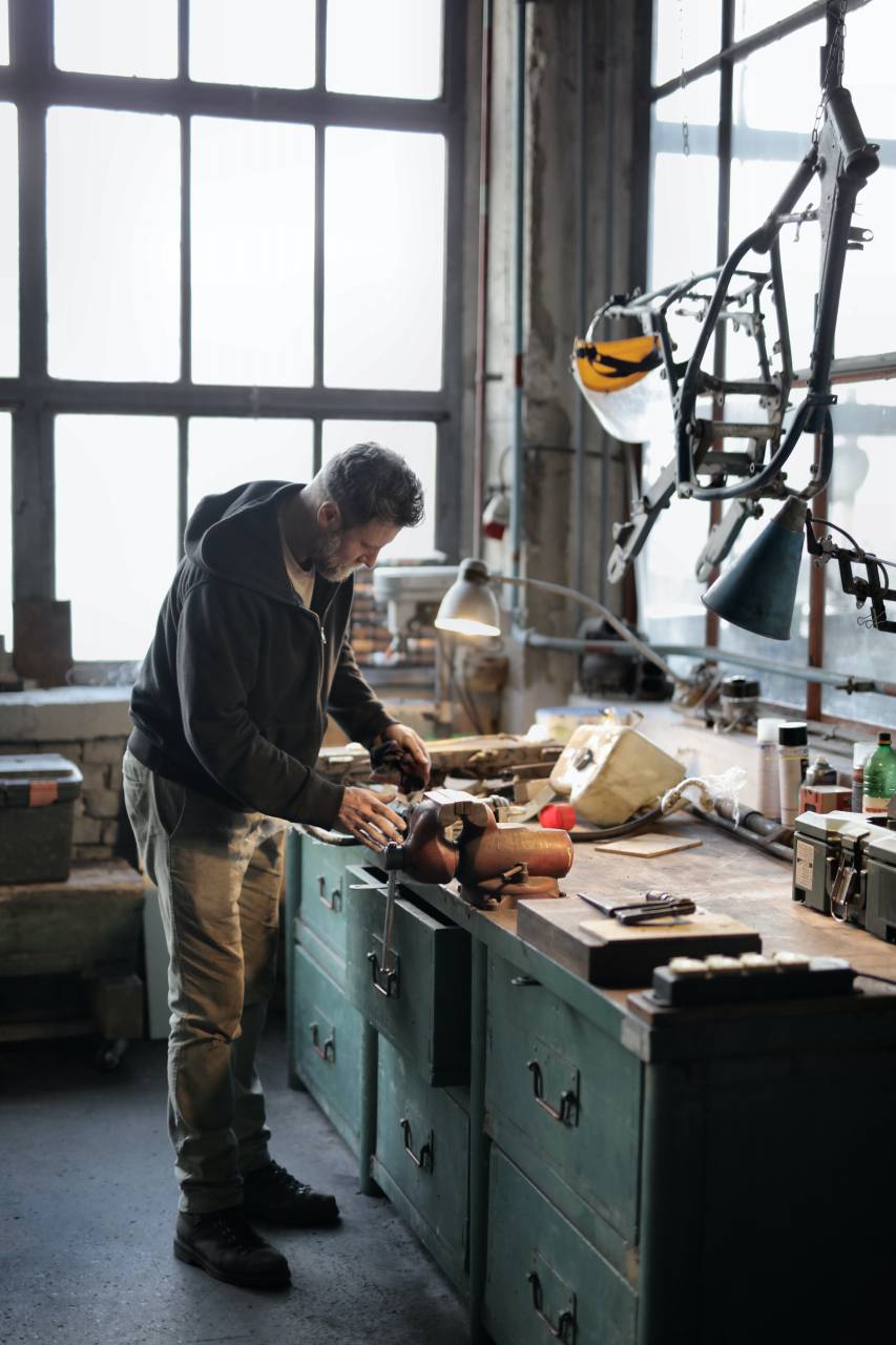Charpenter;workshop,working,men,work tool,carpenter,occupation,one person,indoors,workshop,industry,adult,males,construction industry,expertise,equipment,craft,craftsperson,carpentry,caucasian ethnicity,standing,real people,mid adult,skill,one,man, 