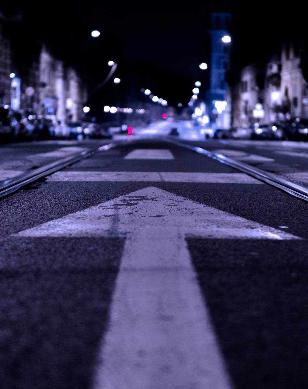 road, sign, arrow, street, rural, city, building, infrastructure, establishment, light, dark, night, line, lane, pedestrian, vehicle
, 