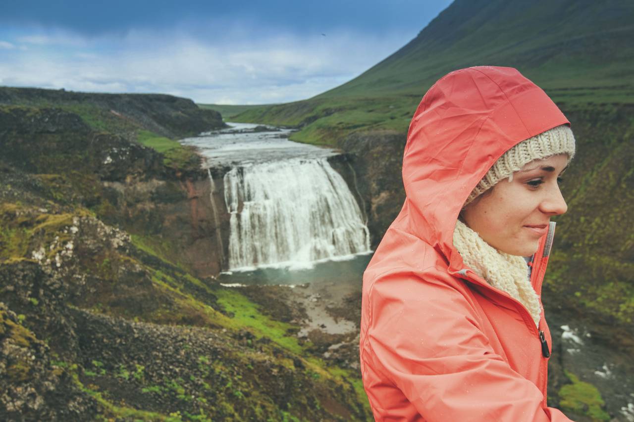 waterfall, stream, water, nature, green, grass, landscape, rocks, moss, view, people, girl, woman, orange, hood, travel, highland, blue, sky
, 