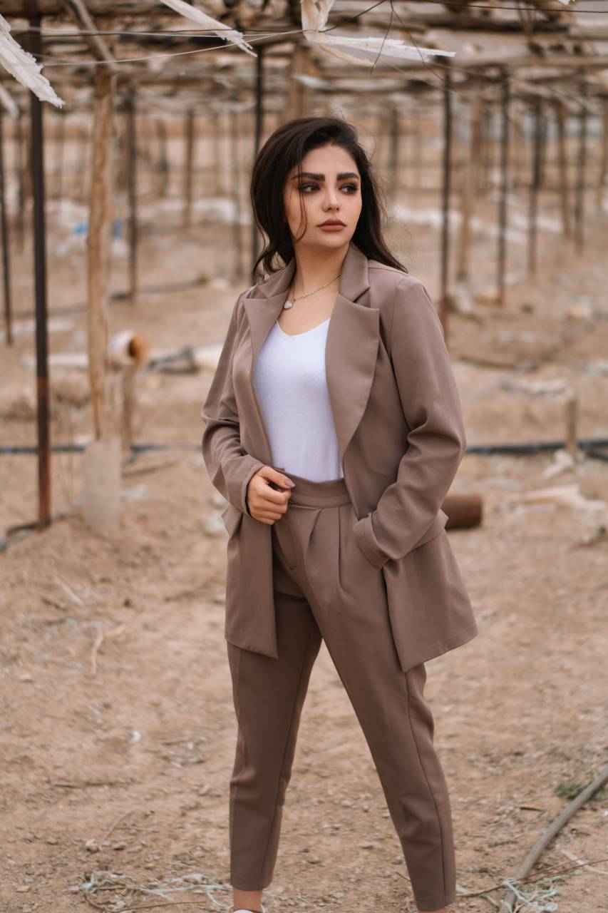 suit,one person,caucasian ethnicity,women,adult,outdoors,suit,business person,young adult,looking at camera,businesswoman,occupation,lifestyles,portrait,fashion model,confidence,smiling,nature,brown hair,looking,elegance,beauty,success,fashion,standing, 