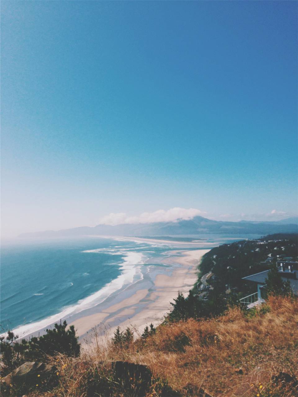 beach, sand, water, waves, shore, ocean, sea, island, trees, plants, landscape, mountains, sky, hills, houses, roads, balcony
, 