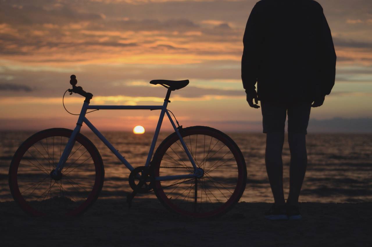 guy, man, male, people, back, contemplate, stand, bicycle, ride, beach, shore, sand, water, ocean, sea, sky, clouds, horizon, sun, dusk, dawn, sunrise, sunset, light, shadows, silhouette
, 