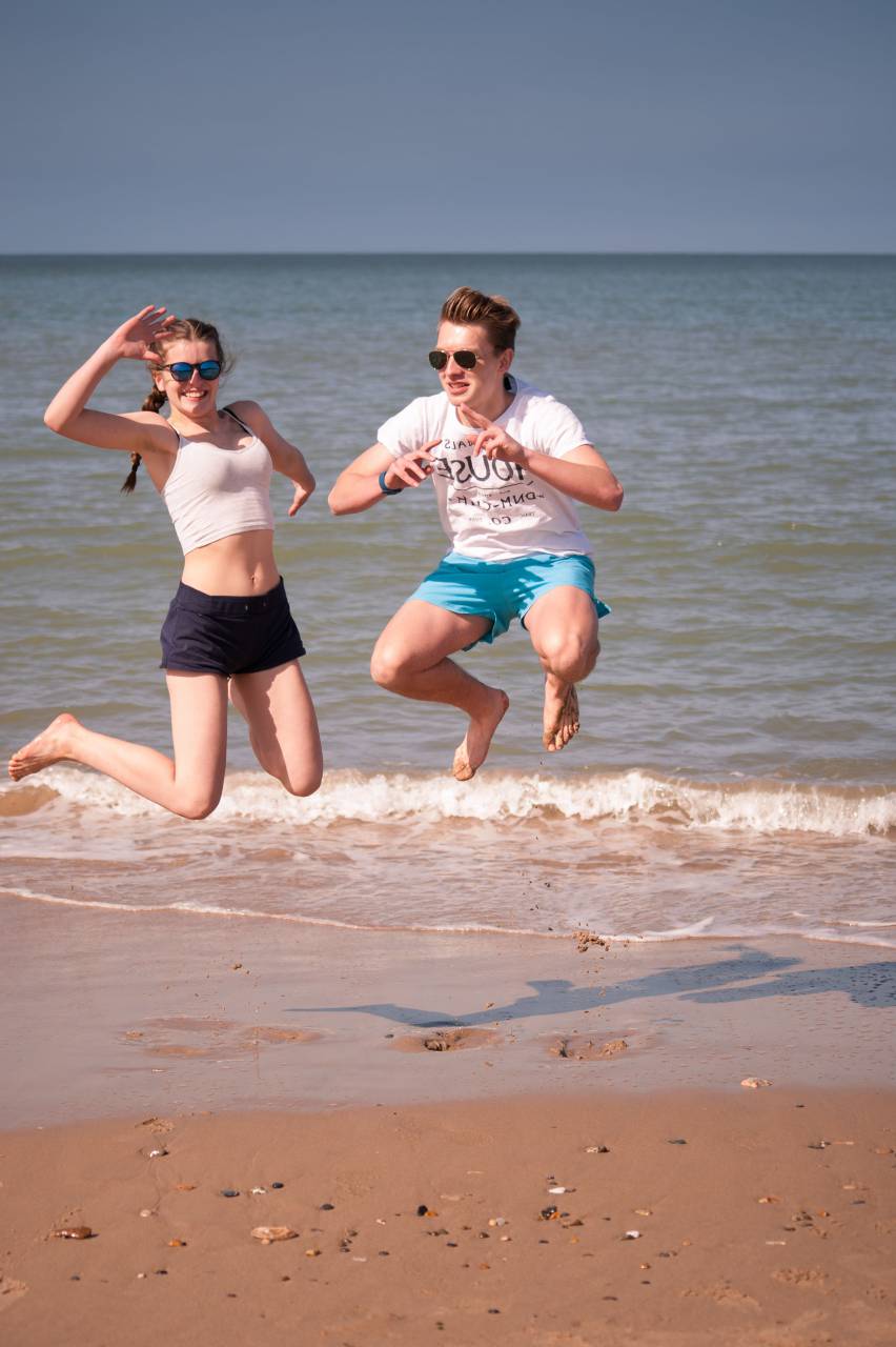 people, jumping, beach, boy, girl, fun, play, ocean, water, sea, shore, coast, sand, vacation, happy, young, leisure, summer
, 