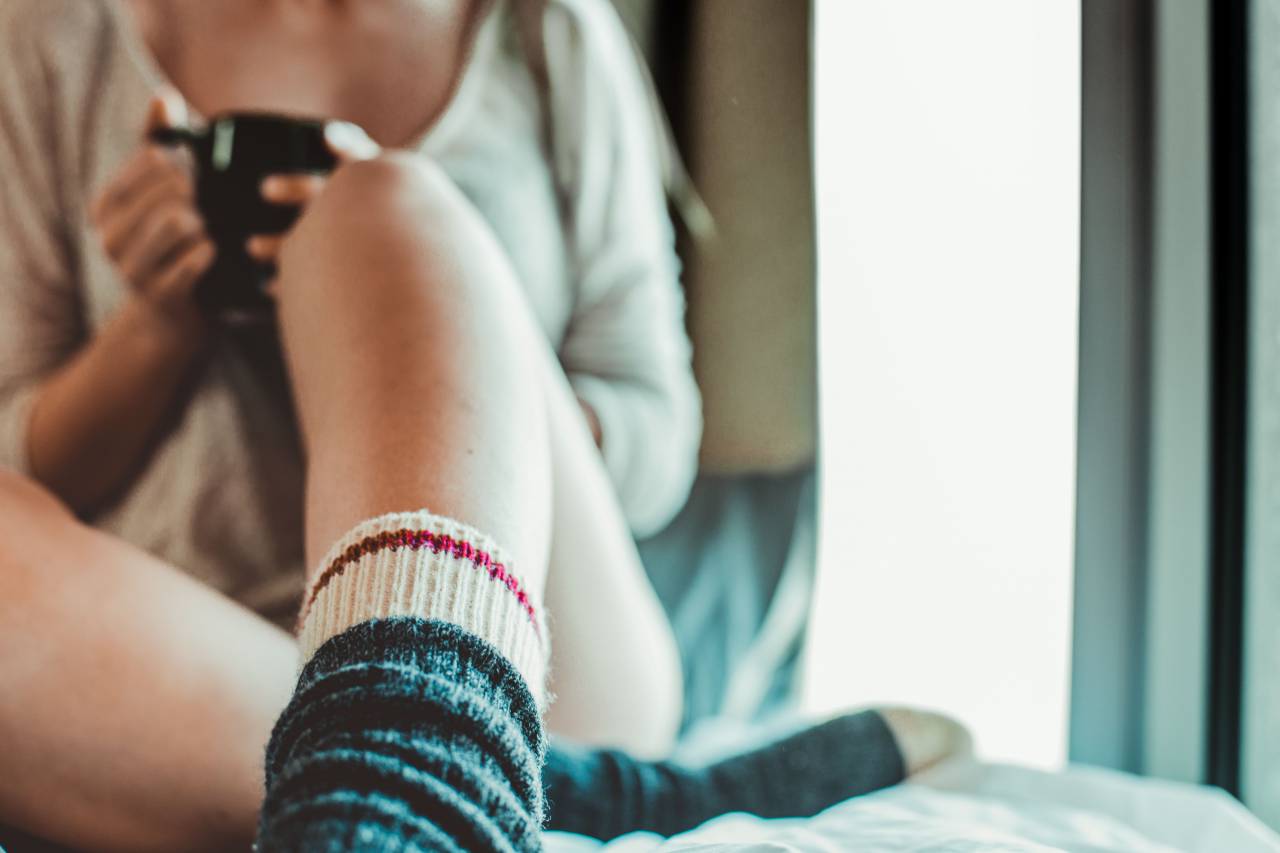 Window, natural light, drinking coffee, coffee, girl, woman, lady, female, socks, legs, feet, ankles, mug, bed, sofa
, 