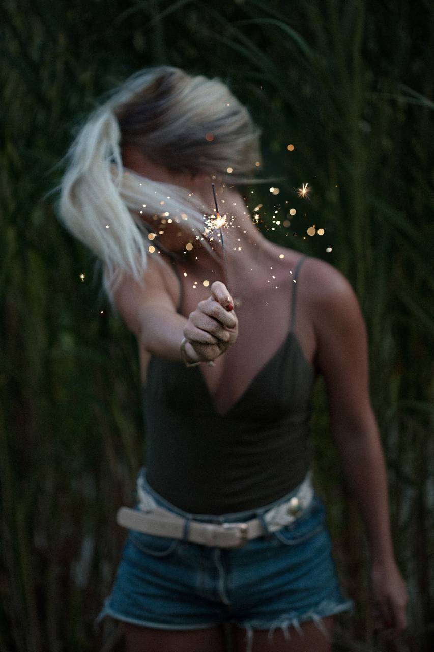 woman, girl, lady, people, stand, fashion, style, hold, out, sparklers, fireworks, sparkle, crackle, sparks, light, orbs, celebrate, field, leaves, still, bokeh, beauty
, 