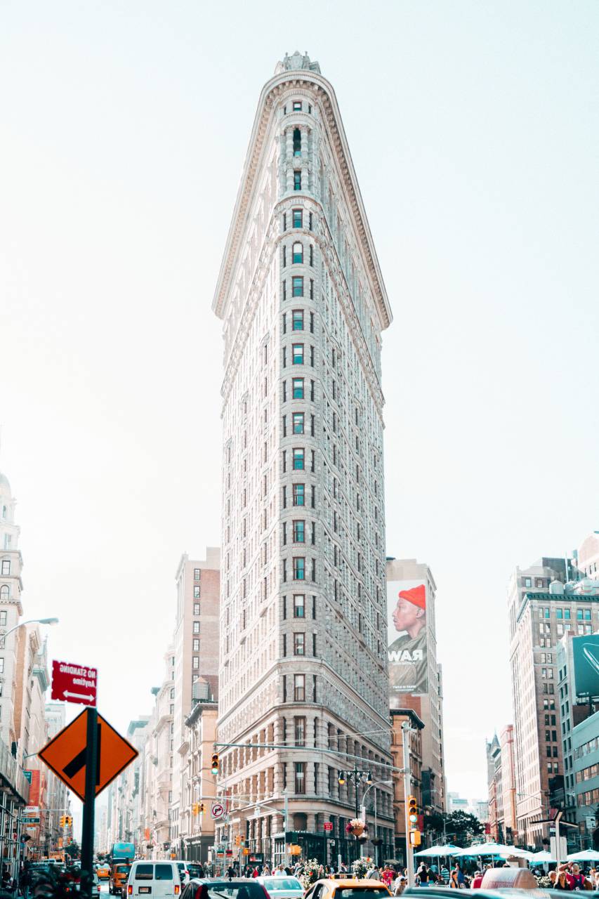 building, structure, architecture, people, men, women, crowd, walking, street, traffic, light, car, vehicle, city, billboard, sign, pole, sky
, 