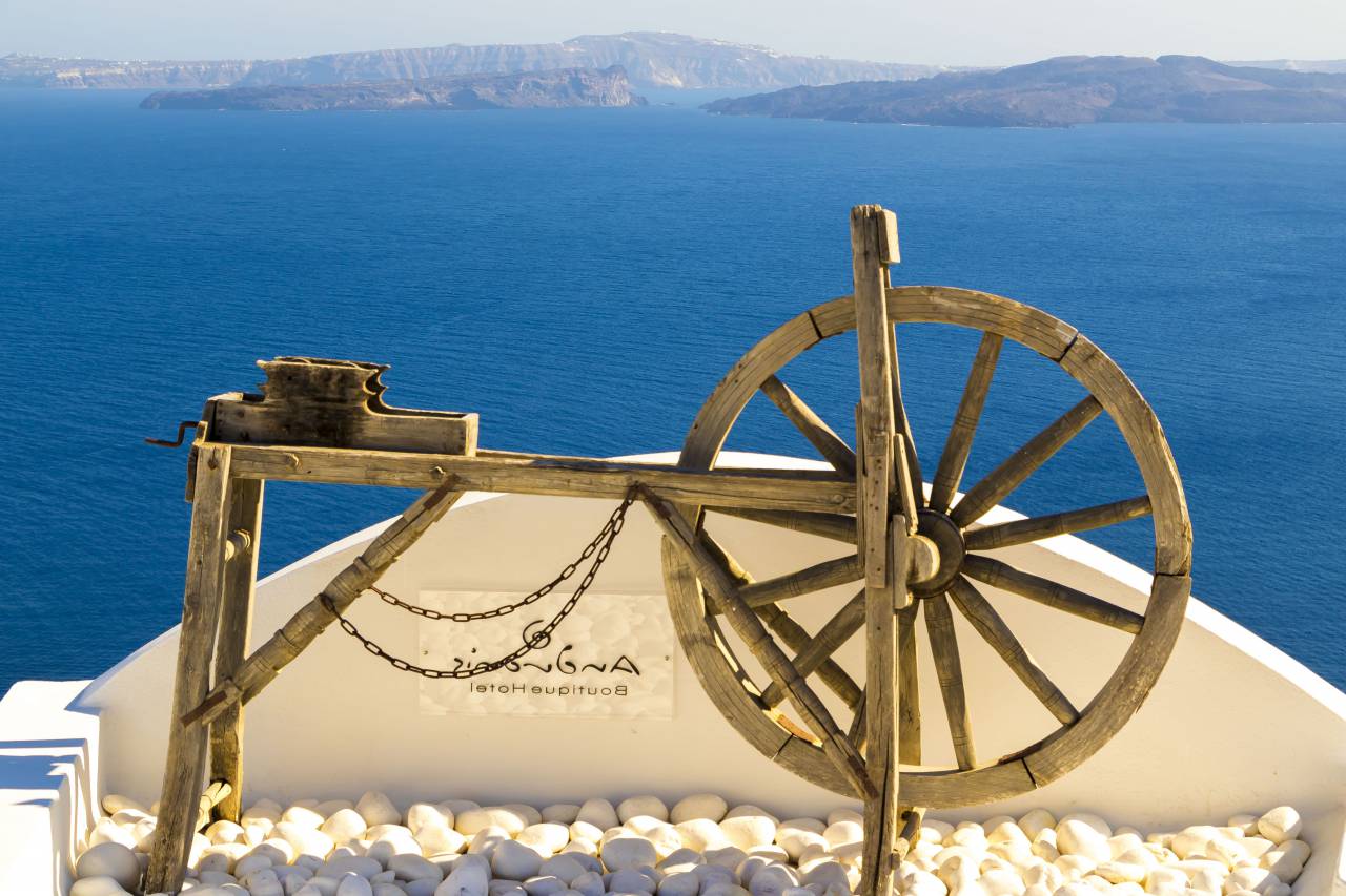 Santorini, Greece, view, hotel, sky, ocean, relax, travel, photo, mountains, trip, vacation, blue, water, boutique, wheel, wood, antique, vintage, paradise, sunshine, summer, landscape, nature, rocks
, 