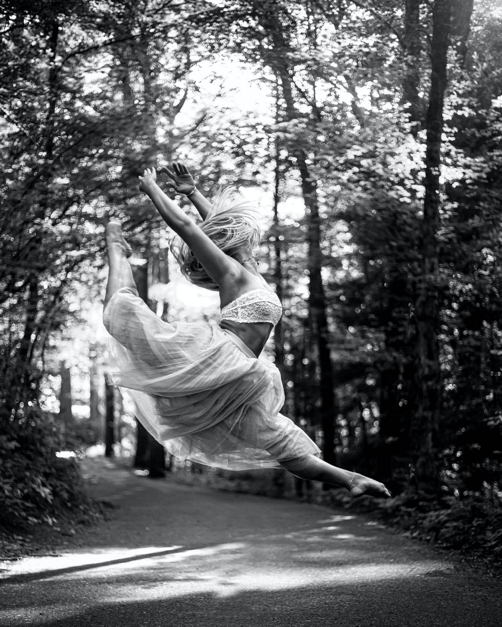 woman;dancing;vallet;Black And White;outdoors,outdoors,women,nature,one person,black and white,caucasian ethnicity,ballet,adult,motion,dancing,ballet dancer,dress,dancer,young adult,lifestyles,beauty,tree,cheerful,joy,fun,forest,summer,females, 