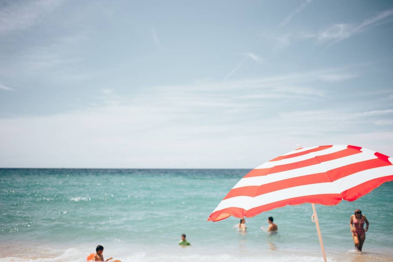 beach, people, umbrella, ocean, water, horizon, sky, clouds, outdoors, swimming, relax, leisure, swimming suit, sunny, summer, warm
, 
