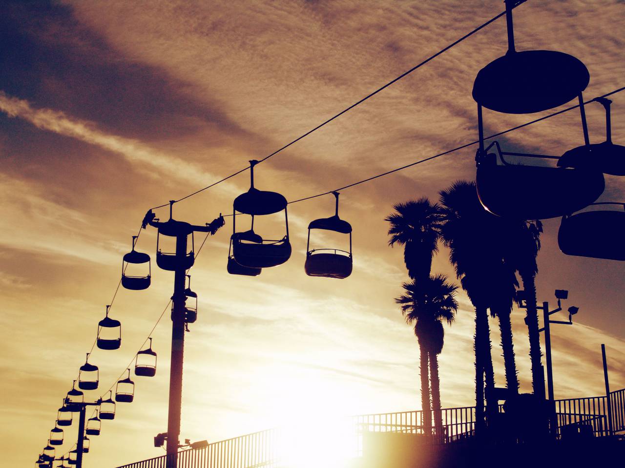 chair lift, cable, sunset, sky, clouds, railing, palm trees, posts
, 