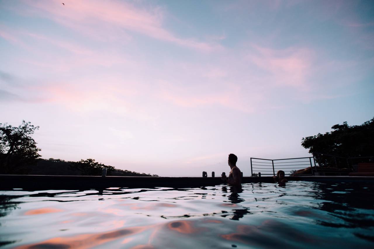 people, man, girl, couple, swimming, pool, water, drinks, beverage, sky, dark, sunset, tree
, 