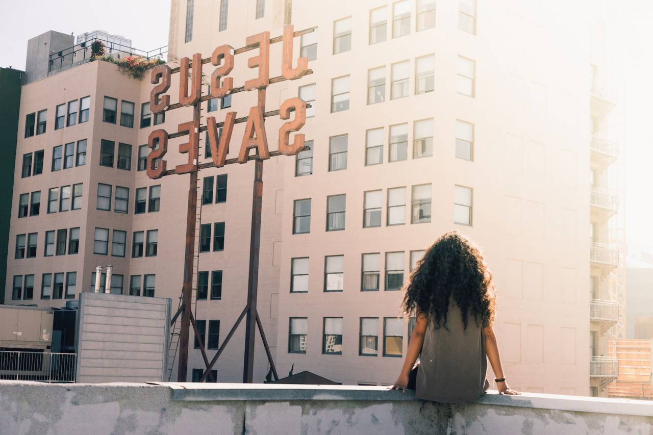 urban, city, buildings, sun, sunlight, people, girl, lady, woman, curly, hair, sitting, jesus
, 