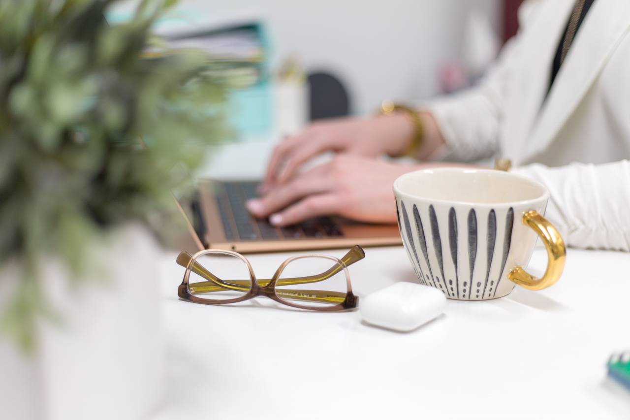 glasses, desk, work, laptop, typing, person, cup, mug, office, table, plant, business, concept, computer, coffee, freelance
, 