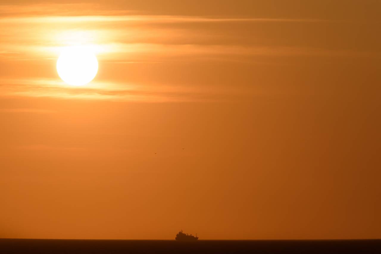 ocean, sunset, ship, sea, boat, warm, golden, horizon, silhouette, sky, view, water, landscape, seascape, nature, transport
, 