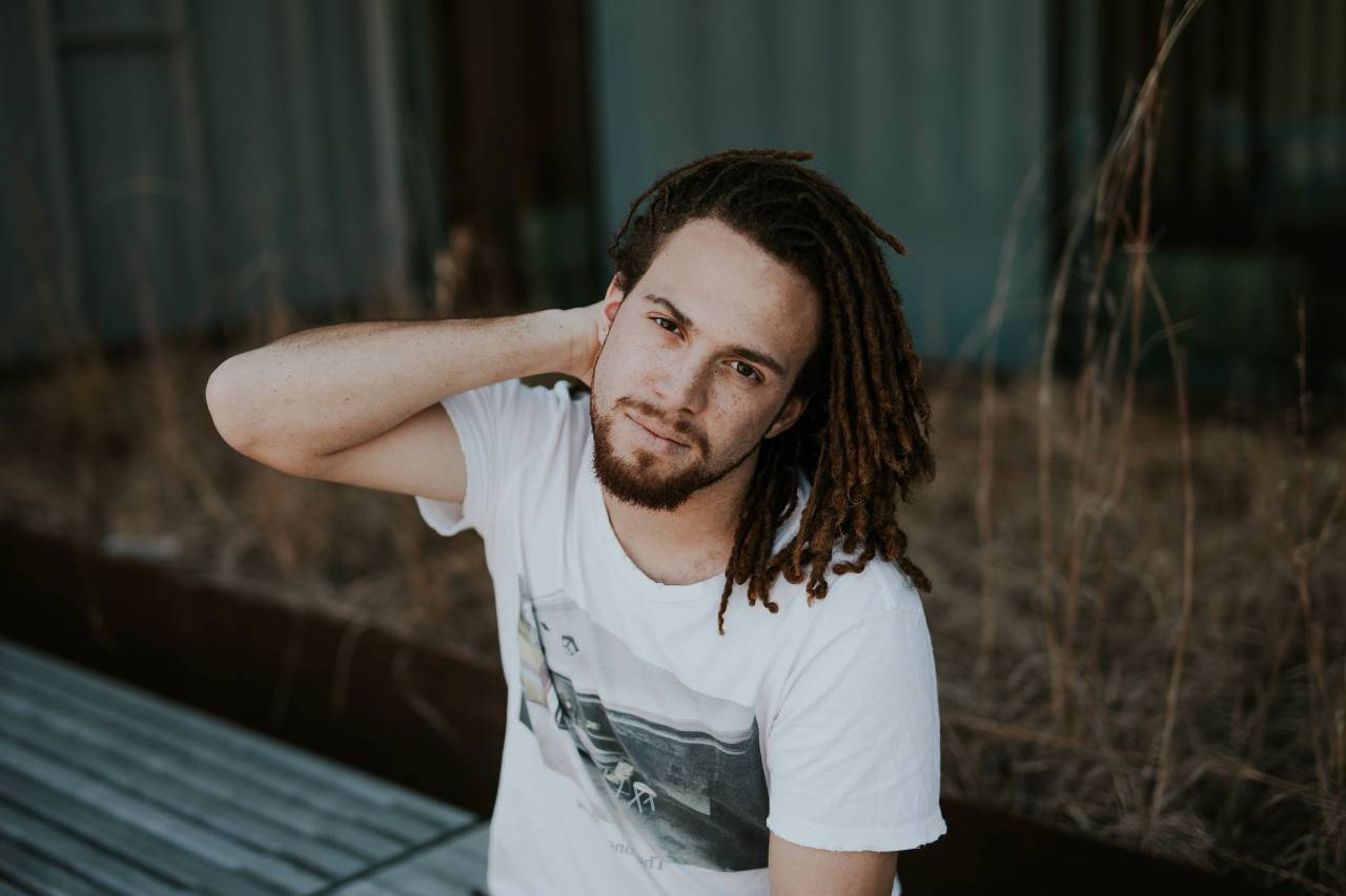 people, man, guy, alone, curly, hair, sitting, outdoor, grass
, 