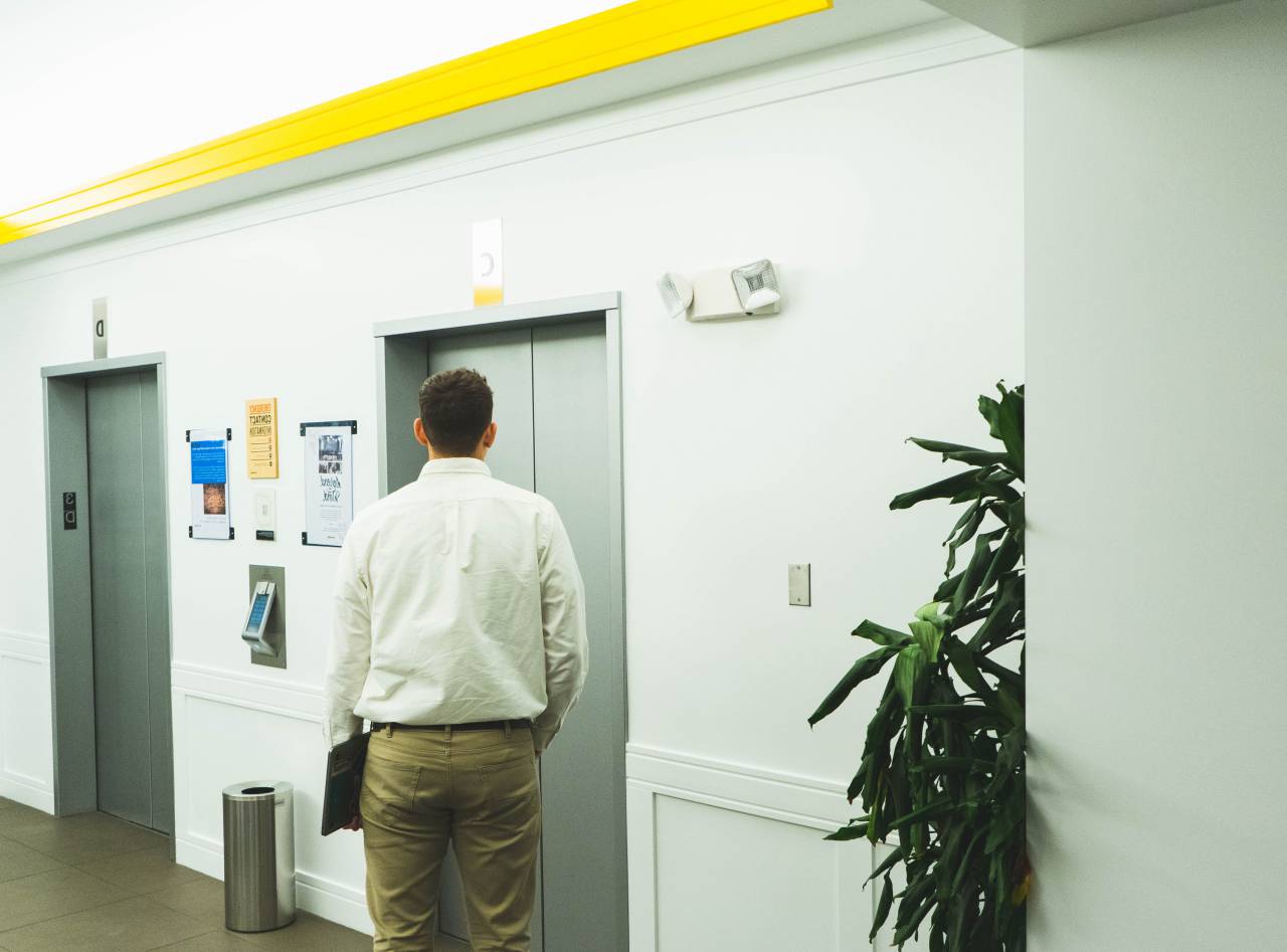elevator, building, person, waiting, man, business, executive, city, ceo, floor, laptop, technology, corporation, casual, office
, 