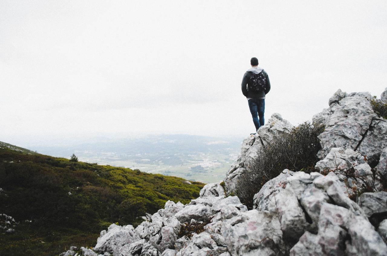 guy, man, male, people, back, contemplate, stand, nature, landscape, mountains, rocks, summit, peaks, rocks, grass, plants, sky, clouds
, 